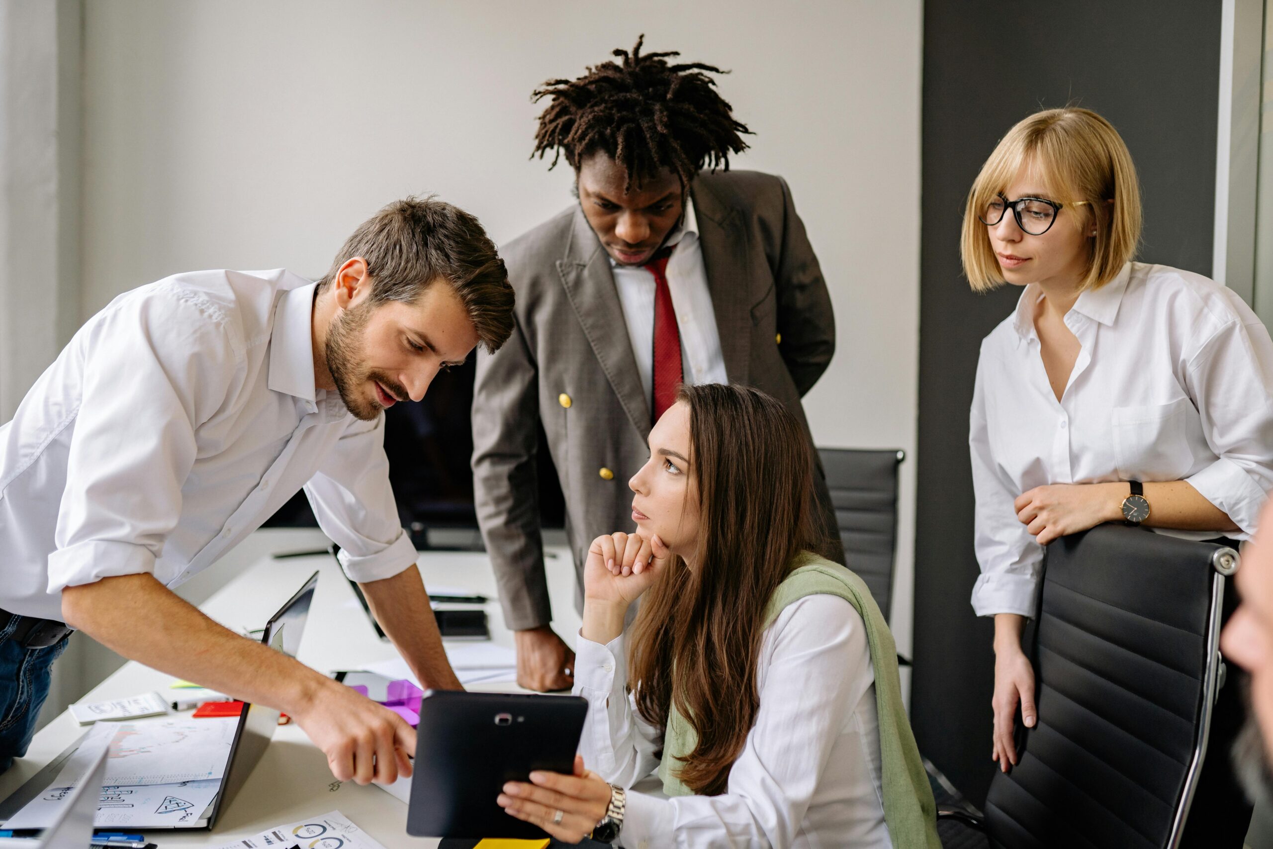 colleagues discussing creative direct sales campaigns