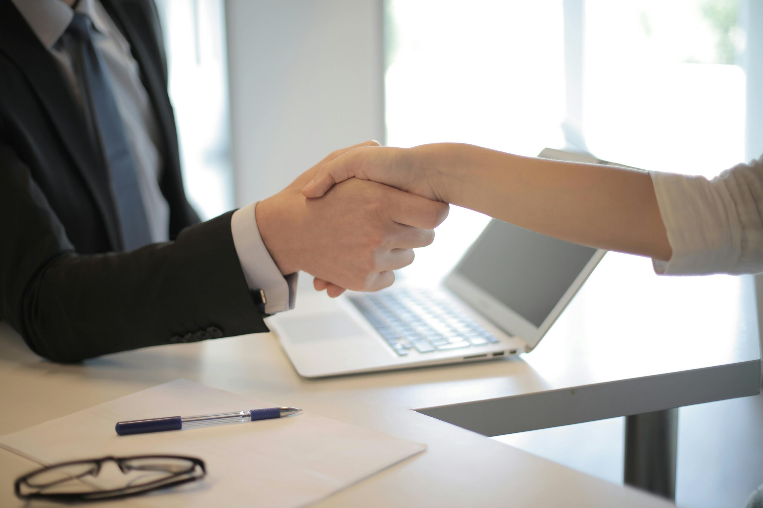 Two people shaking hands.